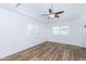 Light-filled room features hardwood floors, recessed ceiling detail, and modern ceiling fan at 222 W Brown Rd # 72, Mesa, AZ 85201