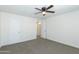 Comfortable bedroom featuring neutral carpet and a ceiling fan for added comfort at 222 W Brown Rd # 72, Mesa, AZ 85201