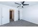 Bedroom features a ceiling fan, neutral carpet, closet, and ensuite access at 222 W Brown Rd # 72, Mesa, AZ 85201