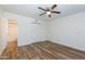 Comfortable bedroom with hardwood floors, closet, and ceiling fan at 222 W Brown Rd # 72, Mesa, AZ 85201