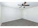 Bedroom features a ceiling fan and neutral carpet at 222 W Brown Rd # 72, Mesa, AZ 85201