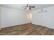 Spacious bedroom with new floors, a ceiling fan, and a large closet at 222 W Brown Rd # 72, Mesa, AZ 85201