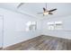 Spacious bedroom with wood floors, ceiling fan, recessed ceiling, and shuttered windows at 222 W Brown Rd # 72, Mesa, AZ 85201