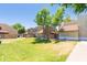 Exterior view of community buildings with lush green grass in the foreground, showcasing the well-maintained landscaping at 222 W Brown Rd # 72, Mesa, AZ 85201