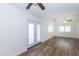 Spacious living room with wood floors, recessed ceiling and glass doors leading to the outside at 222 W Brown Rd # 72, Mesa, AZ 85201