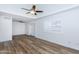 Bright living room featuring hardwood floors, ceiling fan, and access to patio at 222 W Brown Rd # 72, Mesa, AZ 85201