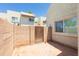 Enclosed patio area featuring a brick wall and access gate at 222 W Brown Rd # 72, Mesa, AZ 85201