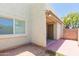 Side patio featuring a small covered area and access to yard at 222 W Brown Rd # 72, Mesa, AZ 85201