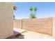 Private patio enclosed by a brick wall and showcasing palm trees at 222 W Brown Rd # 72, Mesa, AZ 85201