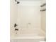 Tub shower with a black shower head, faucet, and a built in shelf at 222 W Brown Rd # 72, Mesa, AZ 85201