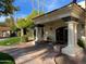 Welcoming clubhouse entrance featuring classic columns and well-manicured landscaping at 2301 E Beachcomber Dr, Gilbert, AZ 85234