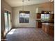 Dining area with sliding doors that let in plenty of natural light for a bright and airy atmosphere at 2301 E Beachcomber Dr, Gilbert, AZ 85234