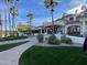 Beautiful landscaping and an inviting covered entrance to the property at 2301 E Beachcomber Dr, Gilbert, AZ 85234