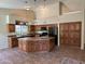 Well-lit kitchen with a large island, modern appliances, and plenty of cabinet space at 2301 E Beachcomber Dr, Gilbert, AZ 85234