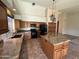 Spacious kitchen with granite countertops, stainless steel appliances, an island, and custom cabinetry at 2301 E Beachcomber Dr, Gilbert, AZ 85234