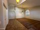 An open living room with archway, carpeted area, and large window with shutters at 2301 E Beachcomber Dr, Gilbert, AZ 85234