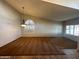Spacious living room featuring neutral walls, carpet, and a large window at 2301 E Beachcomber Dr, Gilbert, AZ 85234