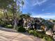Picturesque waterfall feature surrounded by lush greenery and a tranquil stream at 2301 E Beachcomber Dr, Gilbert, AZ 85234