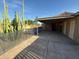 Back patio with concrete, a covered area, and a pool beyond a safety fence at 2331 W Via Rialto Cir, Mesa, AZ 85202