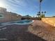 Backyard with pool, desert landscaping, and tall palm trees at 2331 W Via Rialto Cir, Mesa, AZ 85202