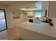 Modern kitchen with white cabinets, stainless steel appliances and quartz countertops at 2331 W Via Rialto Cir, Mesa, AZ 85202
