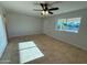 Open living room featuring tile floors and a bright window at 2331 W Via Rialto Cir, Mesa, AZ 85202