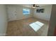 Spacious living room with natural light and a ceiling fan at 2331 W Via Rialto Cir, Mesa, AZ 85202
