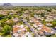An aerial view showcases this neighborhood's charming homes with desert landscaping and mountain views at 2413 E Rancho Dr, Phoenix, AZ 85016