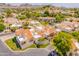 Beautiful aerial view of a community of homes nestled amidst lush greenery, set against a mountain backdrop at 2413 E Rancho Dr, Phoenix, AZ 85016