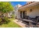 Backyard patio features mature trees, seating, and shade at 2413 E Rancho Dr, Phoenix, AZ 85016
