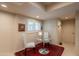 Breakfast nook with tile floors, chair rail, white shutters and glass table with chairs at 2413 E Rancho Dr, Phoenix, AZ 85016