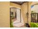 The home's gated courtyard includes a comfortable bench and garden view at 2413 E Rancho Dr, Phoenix, AZ 85016