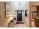 Charming foyer with tile flooring, front door, and art at 2413 E Rancho Dr, Phoenix, AZ 85016