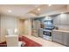 Bright eat in kitchen with stainless steel appliances and lots of storage at 2413 E Rancho Dr, Phoenix, AZ 85016