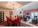 The living room and dining area features tile floors, fireplace, and backyard access at 2413 E Rancho Dr, Phoenix, AZ 85016