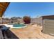 Backyard featuring a sparkling private pool, patio area, and garden beds at 25060 W Vista Norte St, Buckeye, AZ 85326