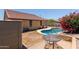 Backyard featuring a private pool, patio area, and beautiful landscaping at 25060 W Vista Norte St, Buckeye, AZ 85326