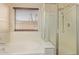 Bathroom featuring soaking tub and walk-in shower with glass doors at 25060 W Vista Norte St, Buckeye, AZ 85326
