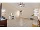 Spacious bedroom with neutral walls, tile flooring, ceiling fan, and natural light at 25060 W Vista Norte St, Buckeye, AZ 85326