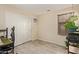 Bedroom with a large closet and tile floor is naturally lit through the window with blinds at 25060 W Vista Norte St, Buckeye, AZ 85326