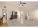 Large bedroom featuring tile floors, a ceiling fan, and backyard access at 25060 W Vista Norte St, Buckeye, AZ 85326