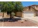 Charming single-story home with a two-car garage and desert landscaping at 25060 W Vista Norte St, Buckeye, AZ 85326