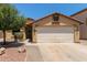 Charming single-story home with low maintenance desert landscaping and two car garage at 25060 W Vista Norte St, Buckeye, AZ 85326