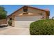 Charming single-story home with two car garage, mature landscaping and desert front yard at 25060 W Vista Norte St, Buckeye, AZ 85326