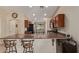 Charming kitchen featuring a breakfast bar and updated appliances at 25060 W Vista Norte St, Buckeye, AZ 85326