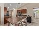 Functional kitchen with a breakfast bar and adjacent dining area at 25060 W Vista Norte St, Buckeye, AZ 85326
