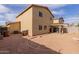 Open backyard presents opportunities for landscaping and outdoor enjoyment at 2509 E Meadow Land Dr, San Tan Valley, AZ 85140