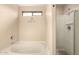This bathroom boasts a separate soaking tub and shower with inspirational wall decor at 2509 E Meadow Land Dr, San Tan Valley, AZ 85140