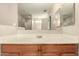 This bathroom features a single sink vanity with a white countertop and a large mirror at 2509 E Meadow Land Dr, San Tan Valley, AZ 85140