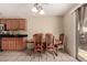Charming dining area features natural light, tile floors, and traditional wood furniture at 2509 E Meadow Land Dr, San Tan Valley, AZ 85140